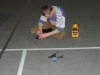 Cristi figuring out his remote control helicopter.JPG